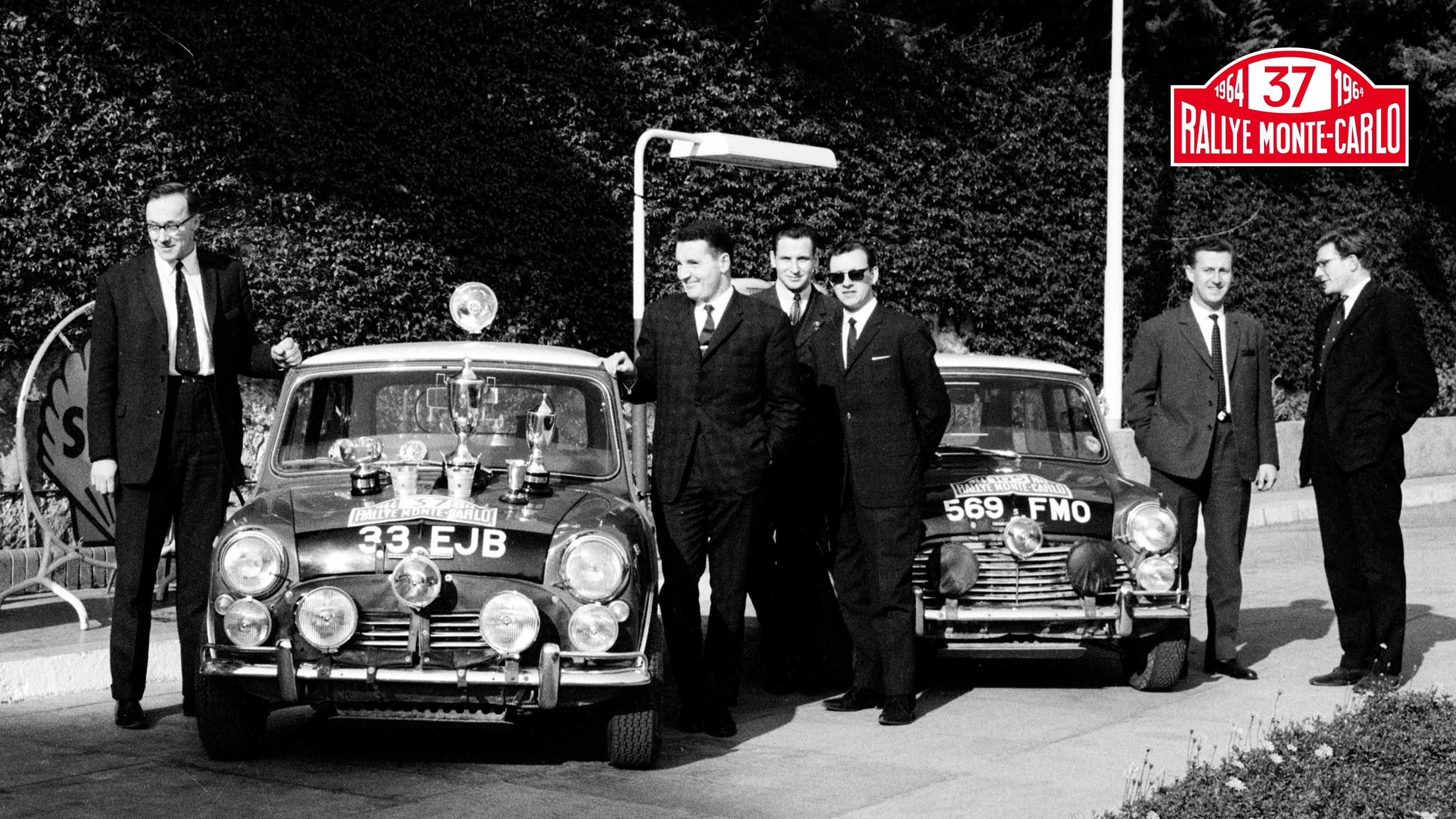 1964 Monte Carlo Rally winners show off their trophies.